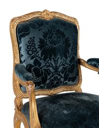 A Pair of Louis XV Carved Giltwood Fauteuils à la Reine