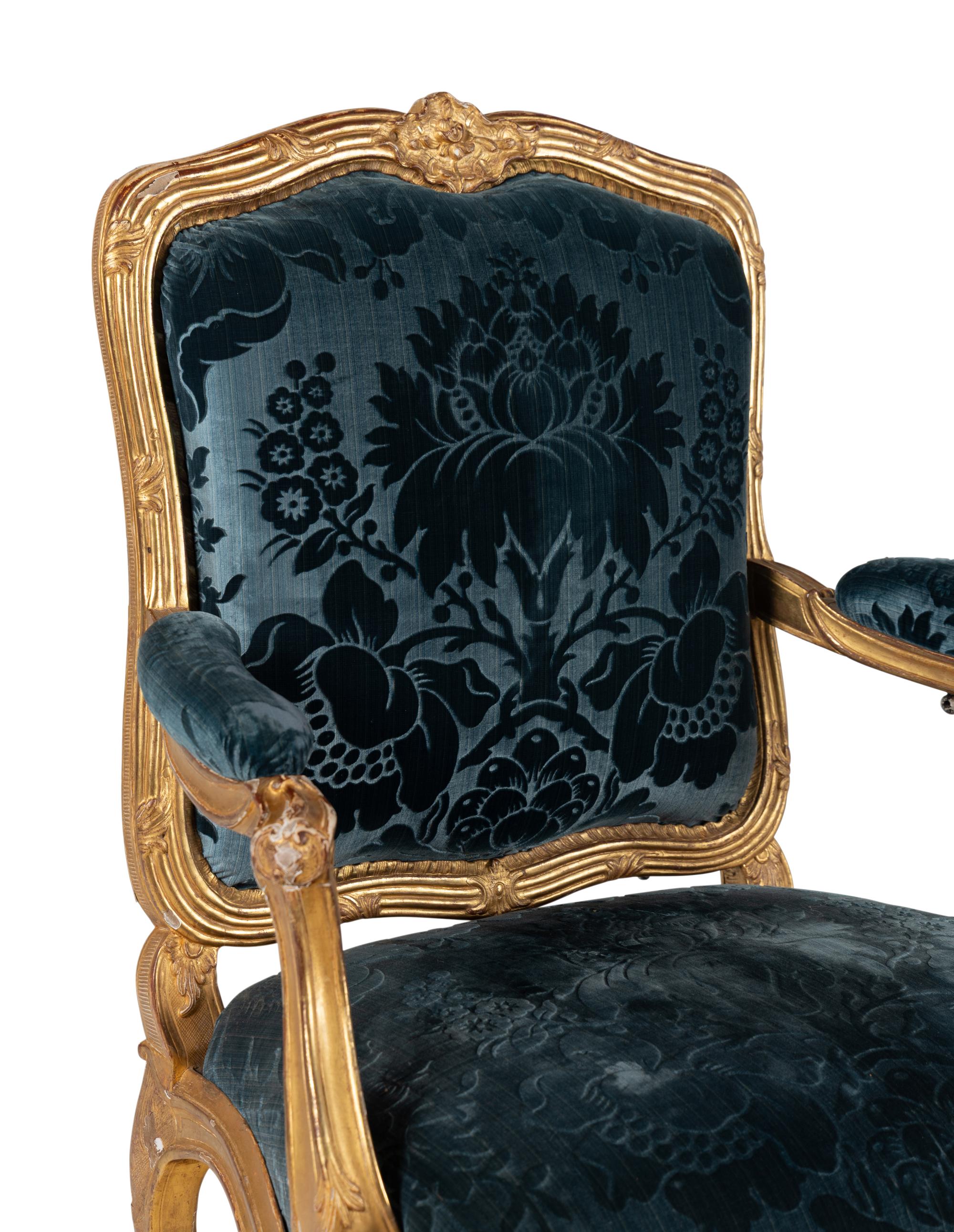 A Pair of Louis XV Carved Giltwood Fauteuils à la Reine