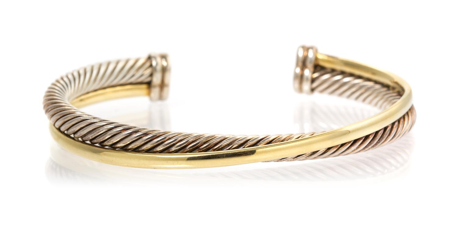 A Sterling Silver and 18 Karat Yellow Gold Crossover Cuff Bracelet, David Yurman, 22.90 dwts.
