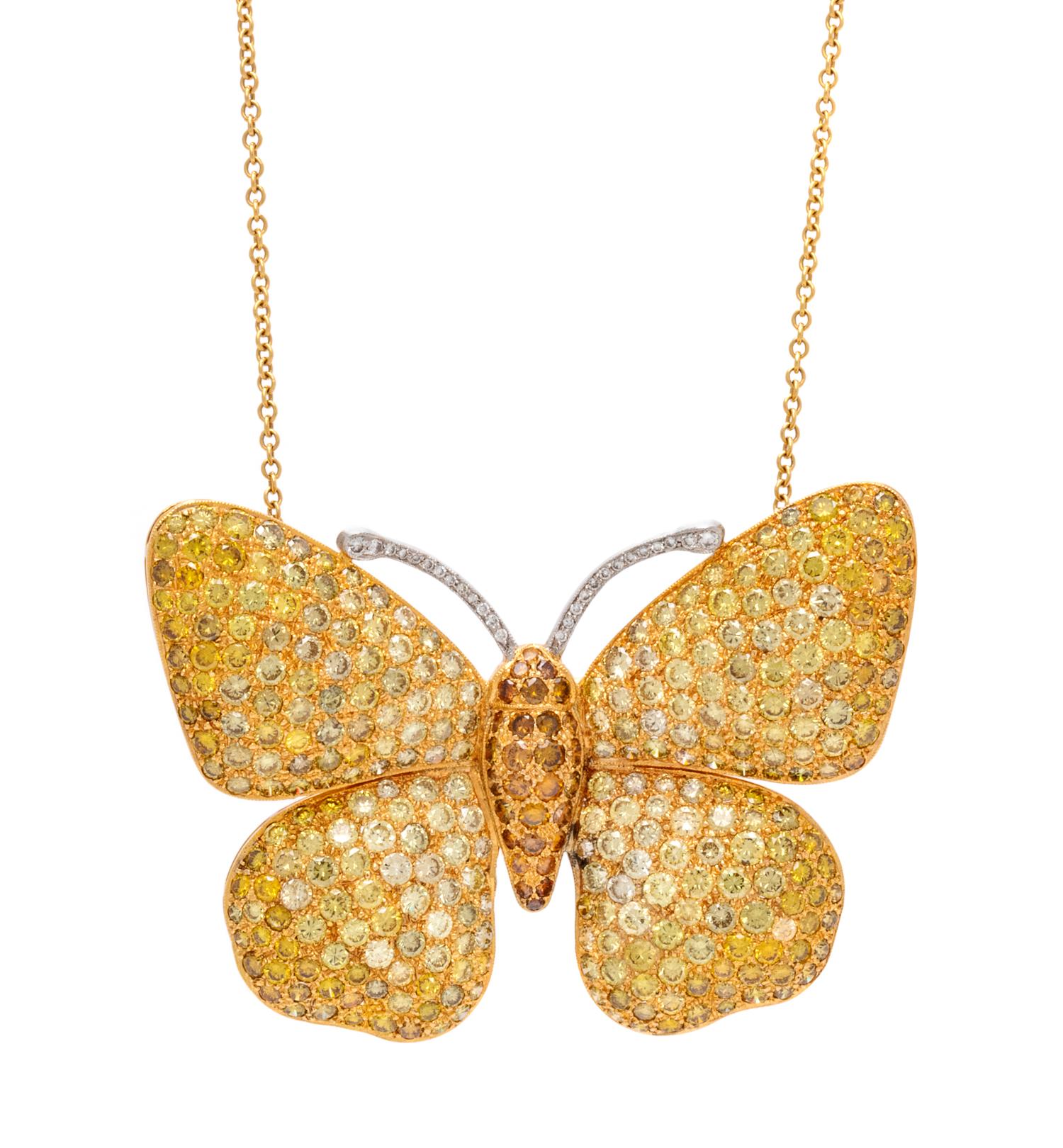 An 18 Karat Bicolor Gold, Diamond and Colored Diamond Butterfly Pendant/Brooch, 14.00 dwts.