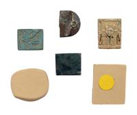 Four Egyptian Faience, Stone, and Metal Plaques with Hieroglyphs