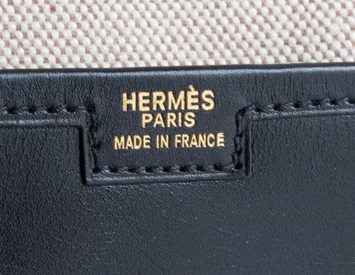 An Hermes Black Jige Elan 29 Swift Clutch, 11.5" x 6"x 1.5".