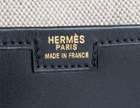 An Hermes Black Jige Elan 29 Swift Clutch, 11.5" x 6"x 1.5".