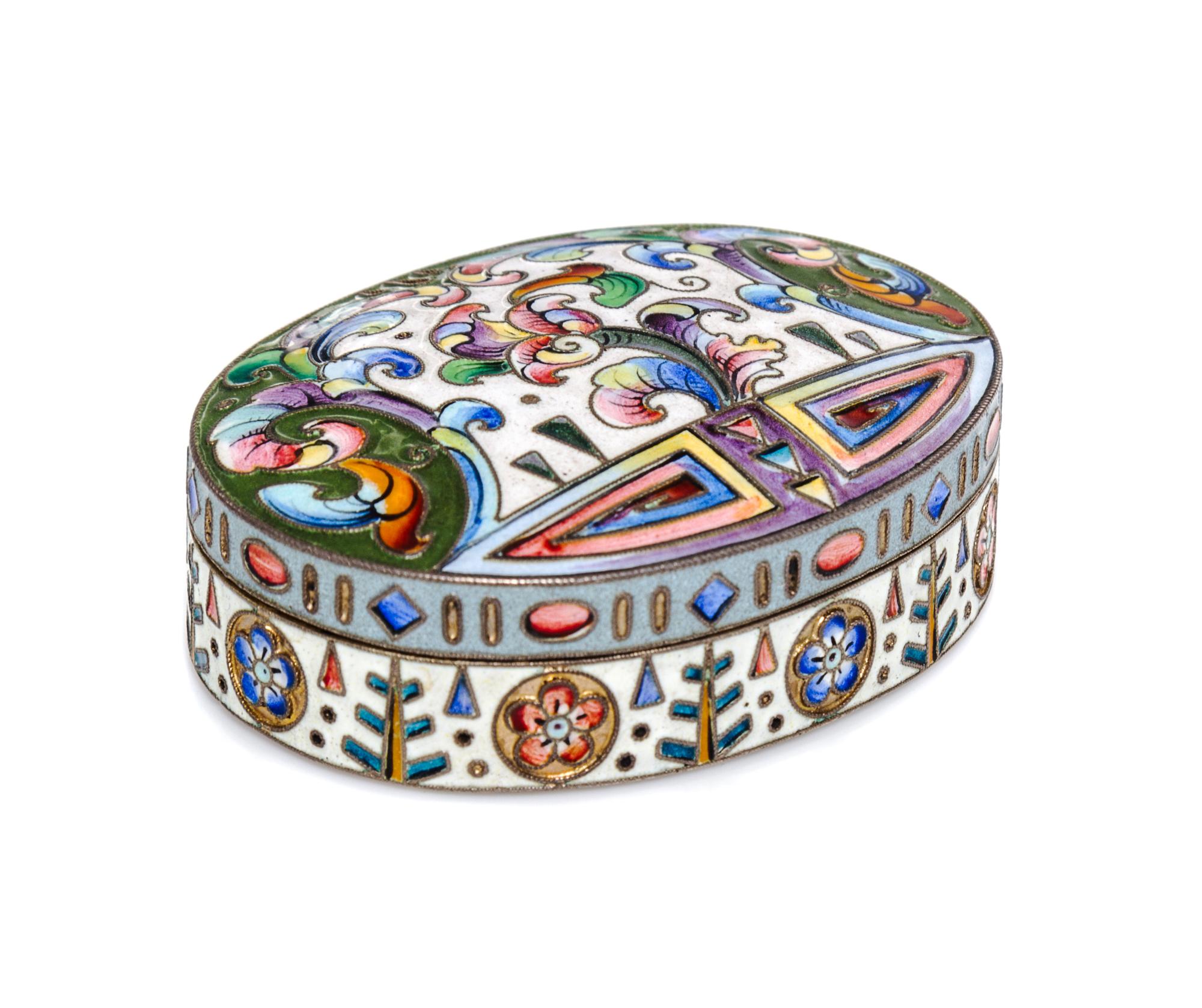 A Russian Enameled Silver Pill Box, 6th Artel, Moscow, 1908-1926, of oval form with floral and geometric decoration.