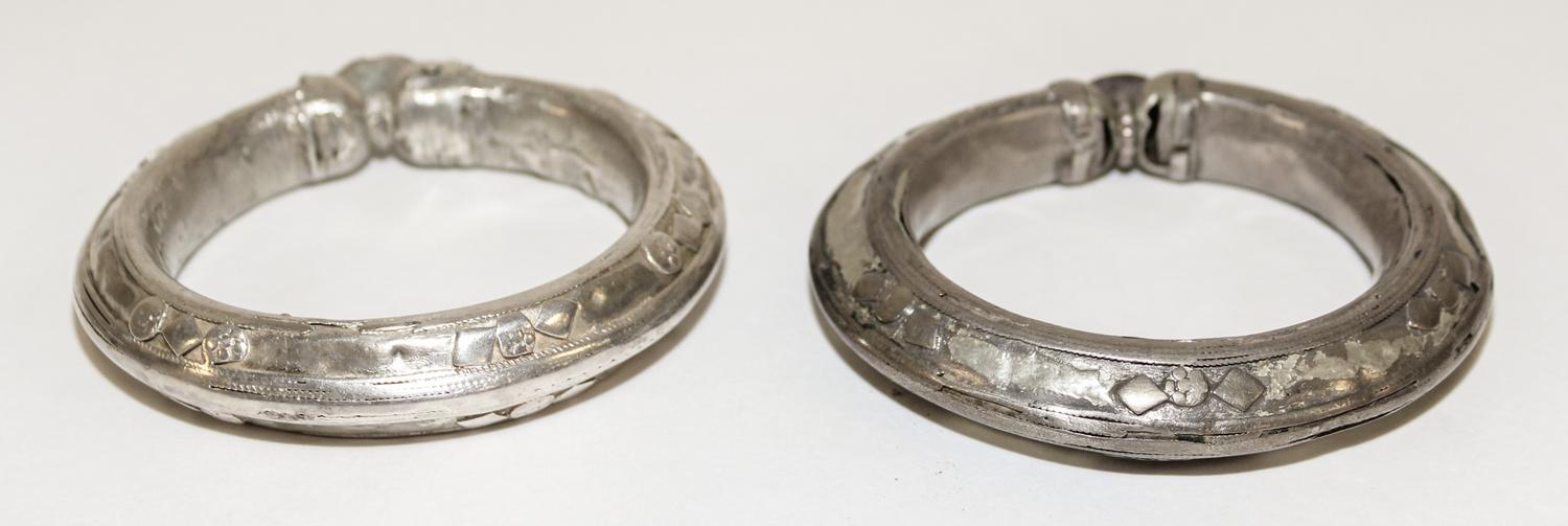A Pair of Yemeni Silver Bangles Diameter of exterior 3 1/2 inches.