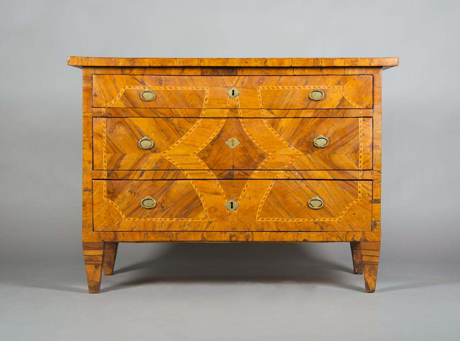 A Continental Parquetry Commode, Height 33 1/2 x width 47 x depth 23 3/4 inches.