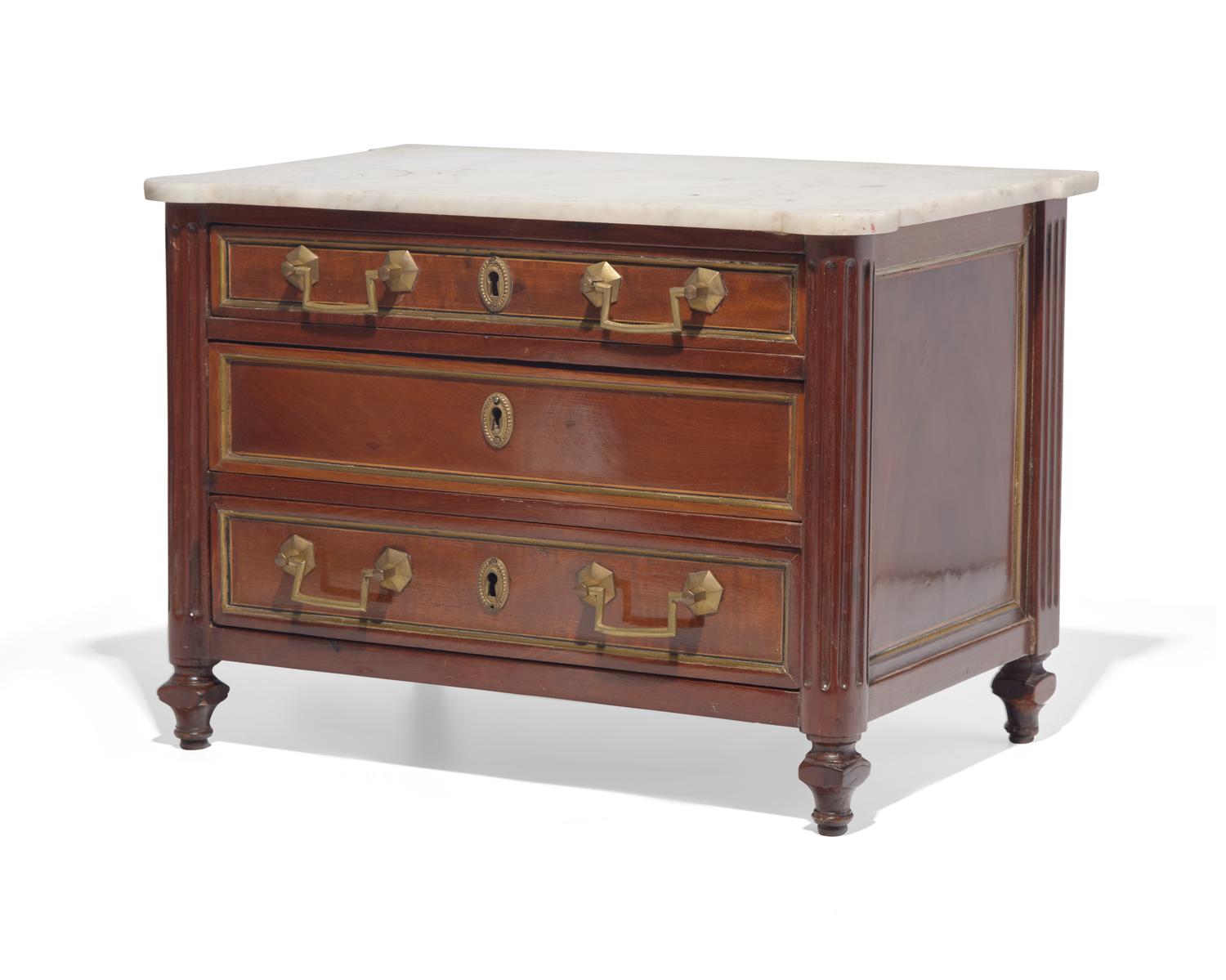 A miniature Directoire inlaid and brass-mounted mahogany commode with white marble top, circa 1800