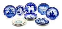 Twelve Porcelain Samoyed Plates Diameter of largest 7 3/4 inches.