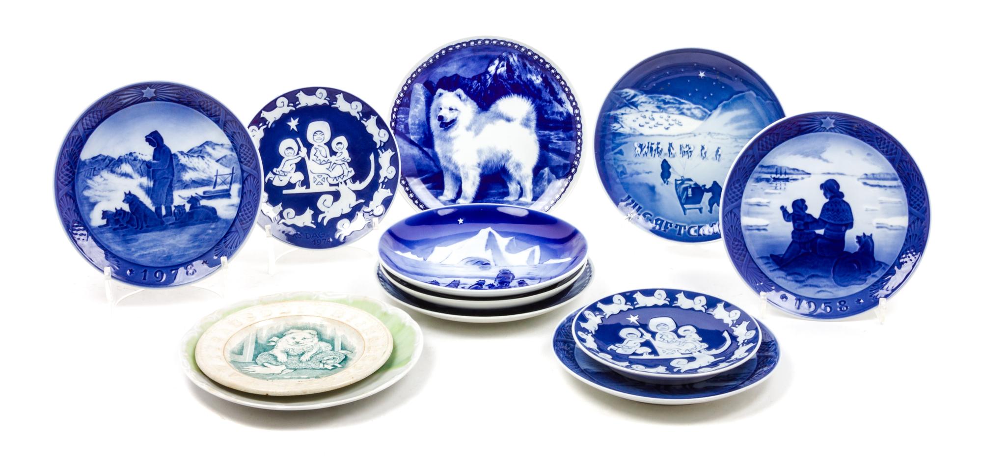 Twelve Porcelain Samoyed Plates Diameter of largest 7 3/4 inches.