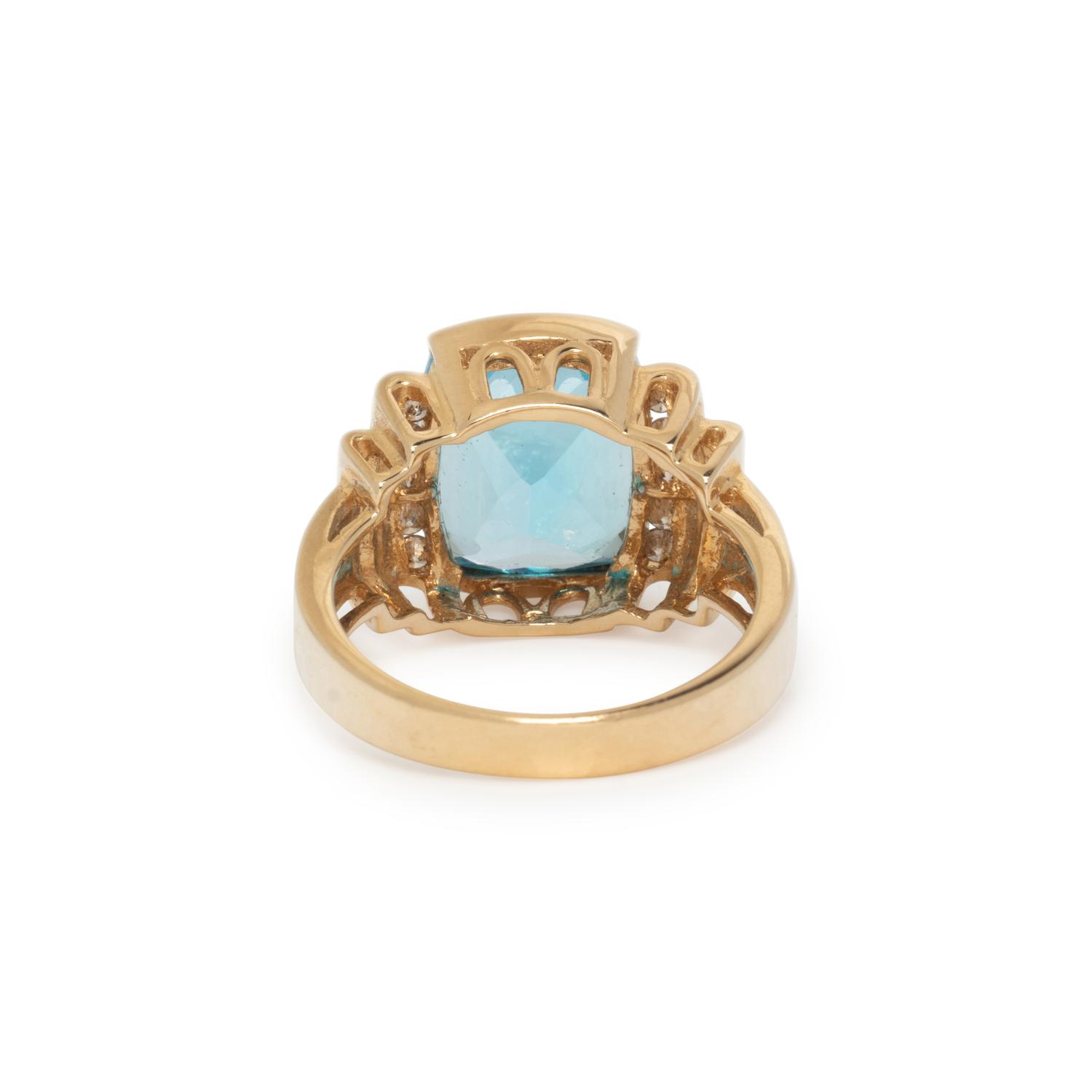 YELLOW GOLD, BLUE TOPAZ, AND DIAMOND RING