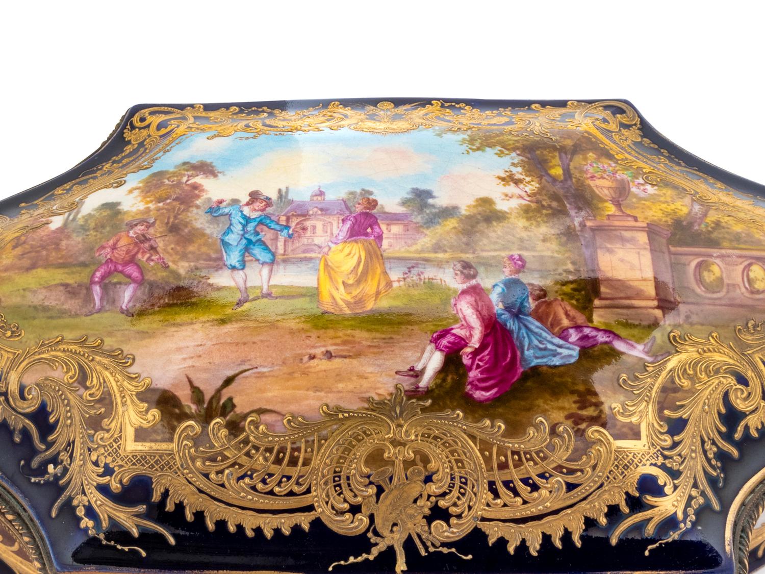 A Sèvres Style Painted and Parcel Gilt Porcelain Table Casket