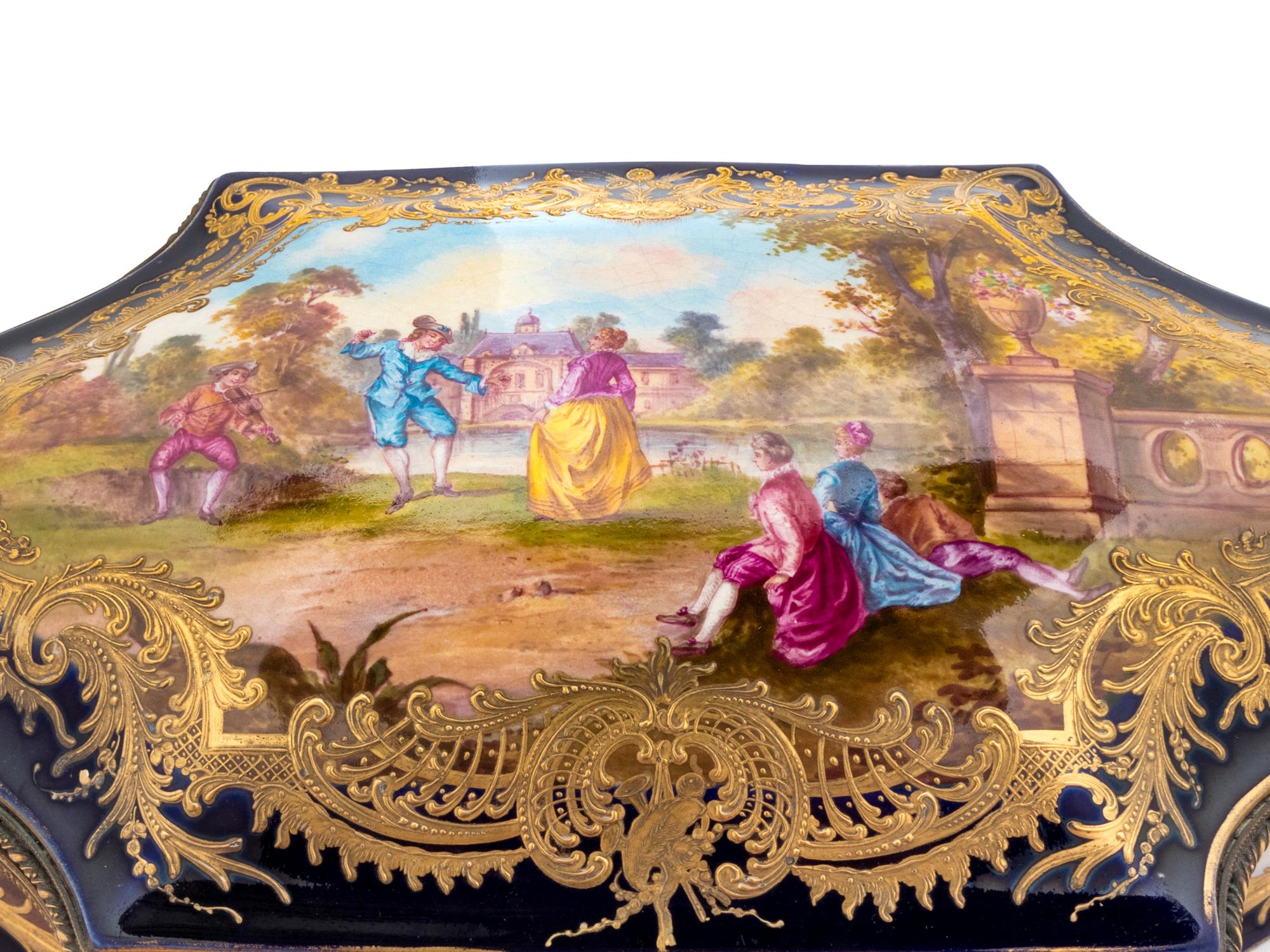 A Sèvres Style Painted and Parcel Gilt Porcelain Table Casket
