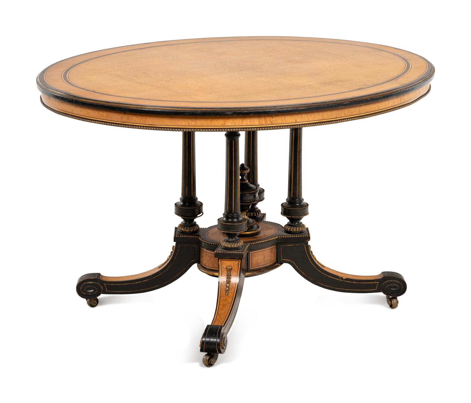 A Continental Parcel Ebonized Center Table