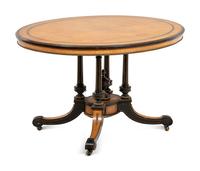 A Continental Parcel Ebonized Center Table