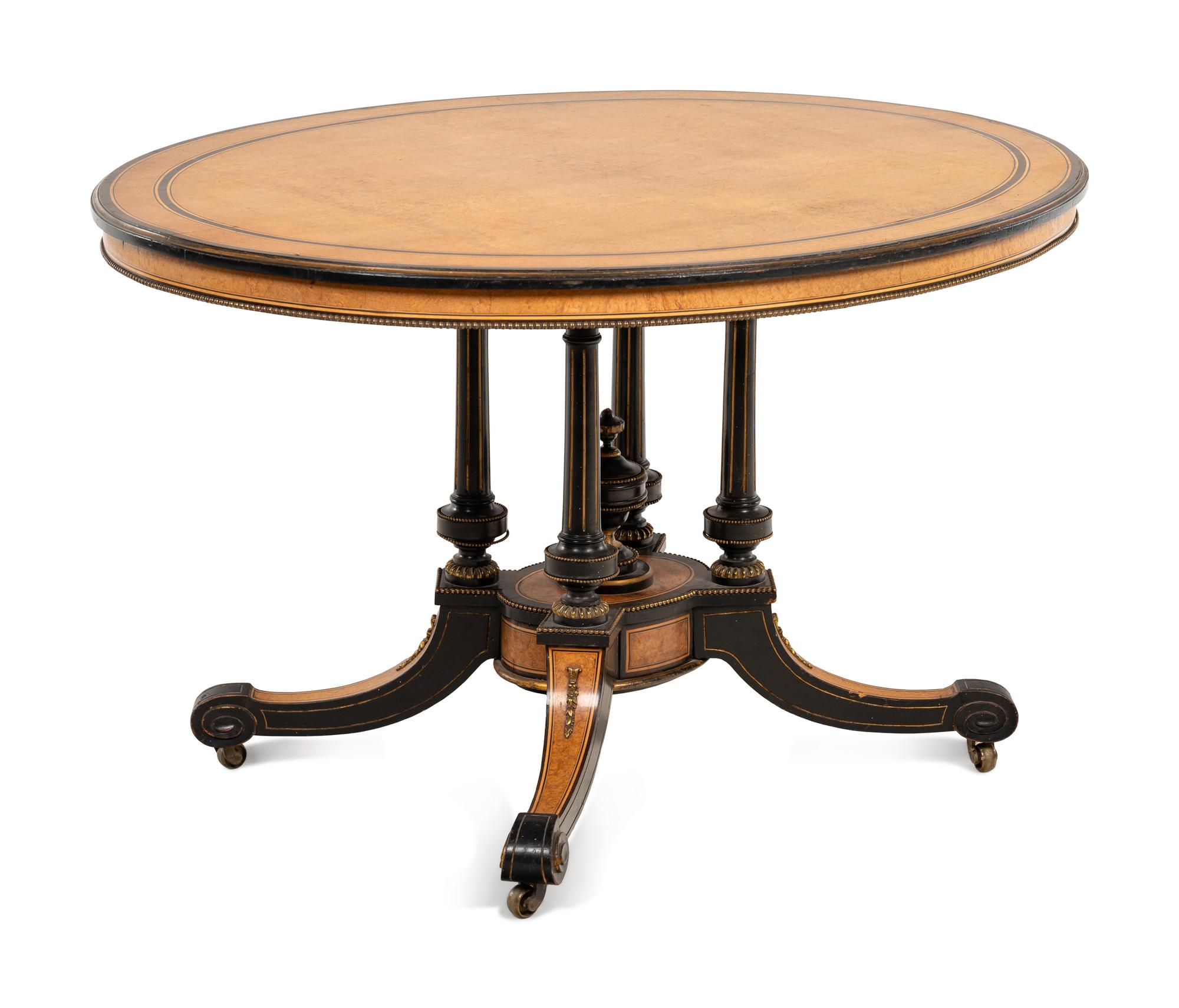 A Continental Parcel Ebonized Center Table