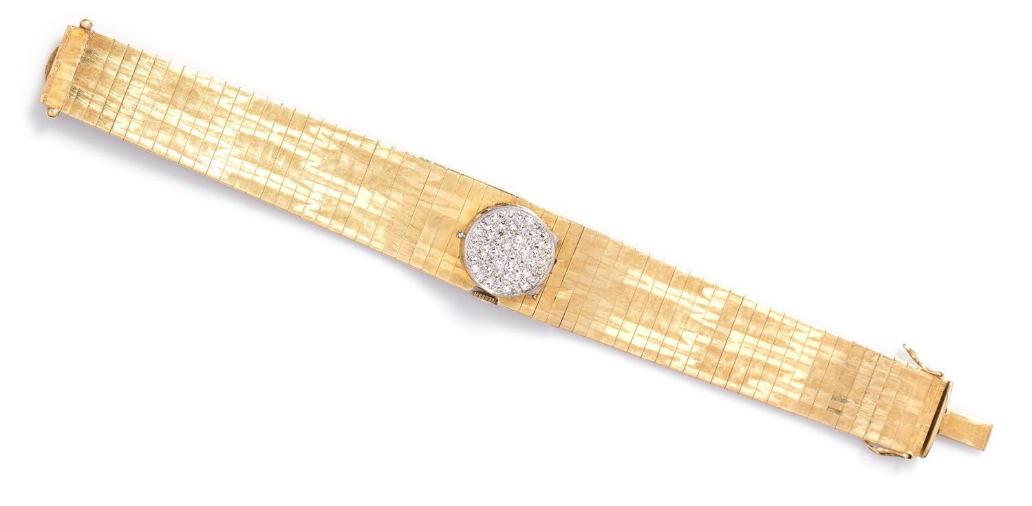 An 18 Karat Yellow Gold and Diamond Surprise Watch, 36.20 dwts.