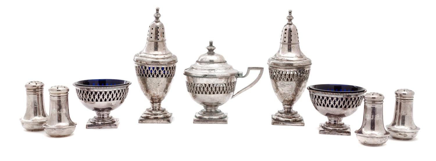 A Group of Eight Salt and Pepper Shakers Height 4 inches.