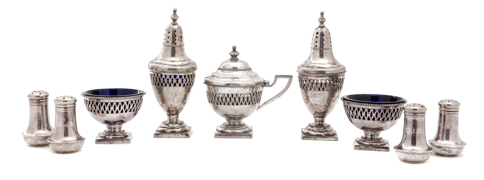 A Group of Eight Salt and Pepper Shakers Height 4 inches.
