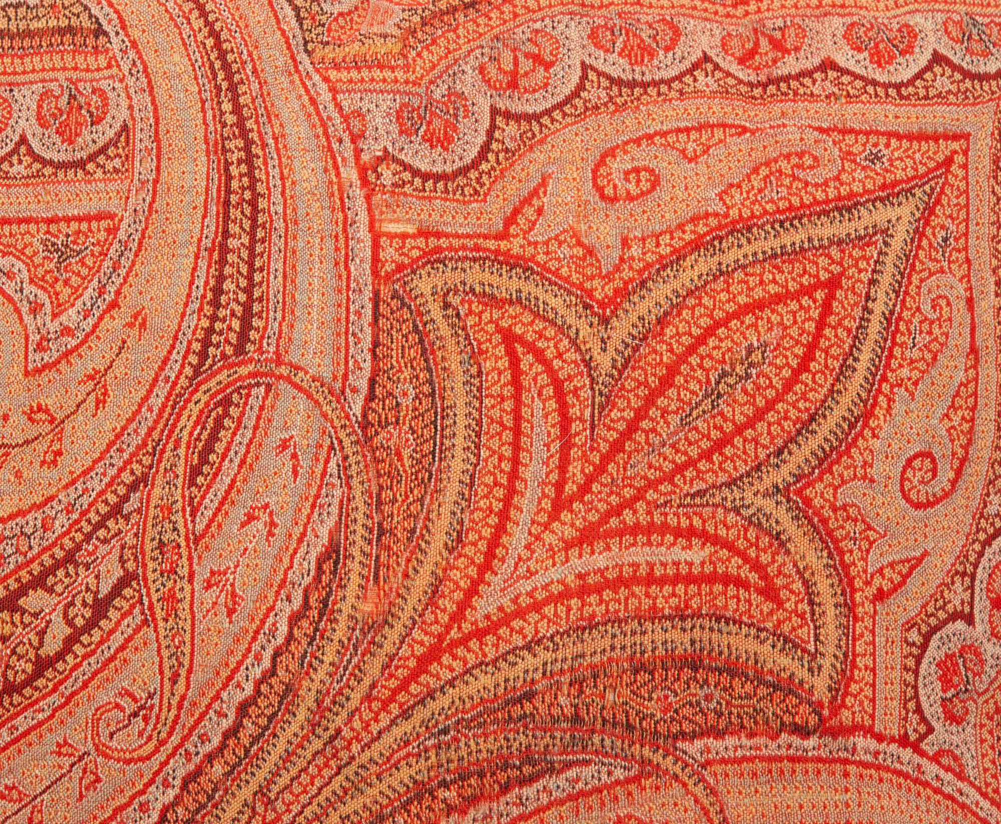 Four Paisley Covered Pillows with Black Braid Trim