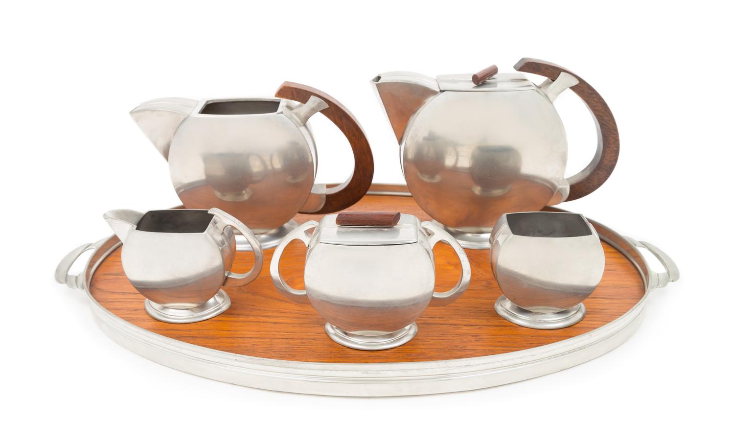 Art Deco, Holland, a tea and coffee service, comprising a tea pot, coffee pot, creamer, sugar, covered dish and tray