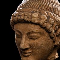 A Cypriot Limestone Head of a Youth