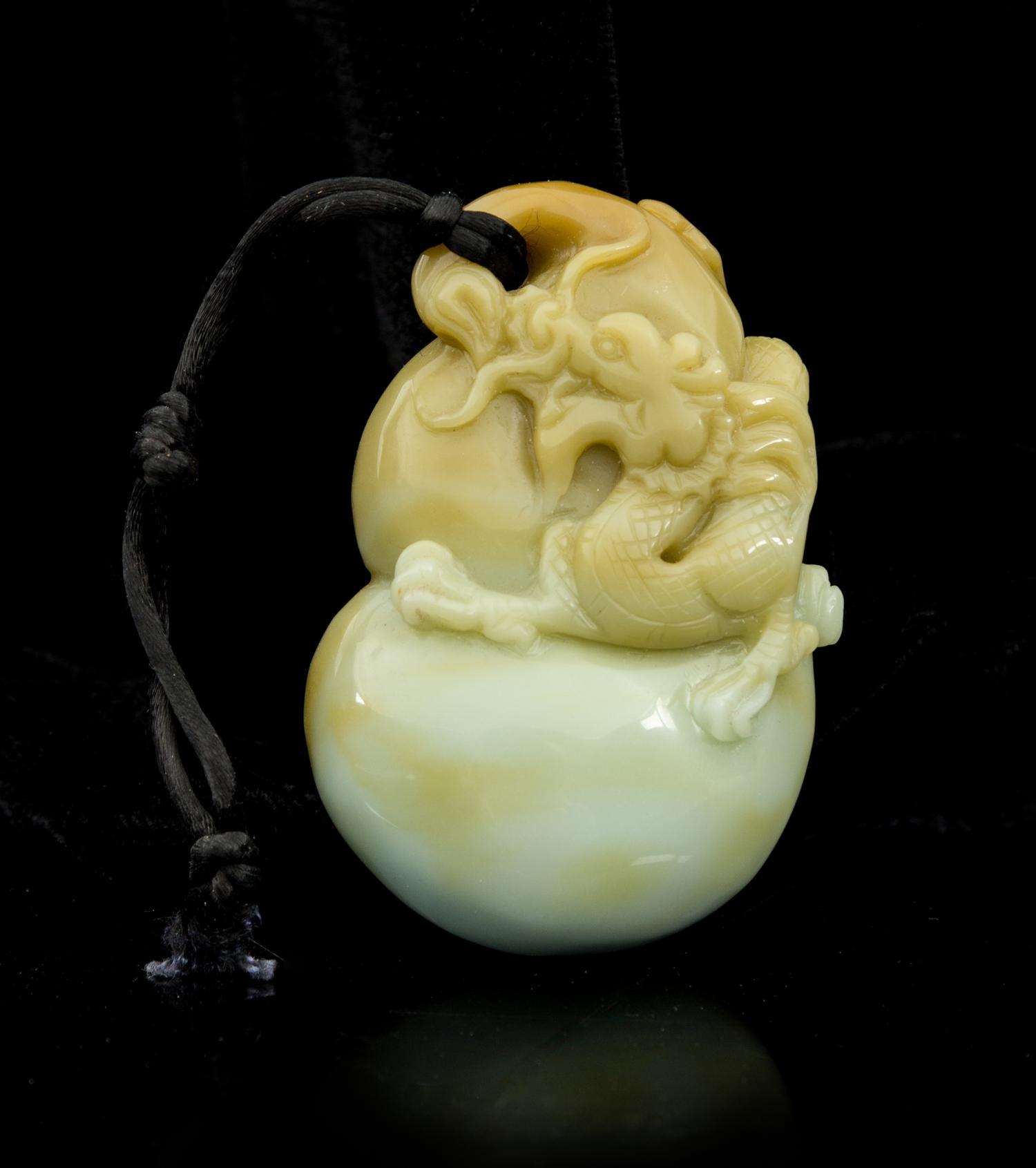 A Carved Jade Toggle Length 3 1/4 inches.