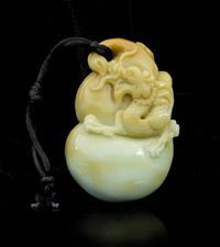 A Carved Jade Toggle Length 3 1/4 inches.