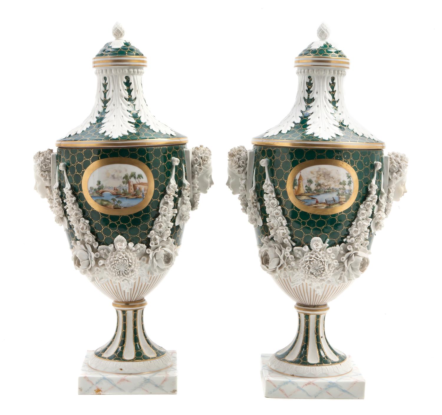 A Pair of English Porcelain Covered Urns, retailed by Ovington Brothers, Height overall 14 1/2 inches.