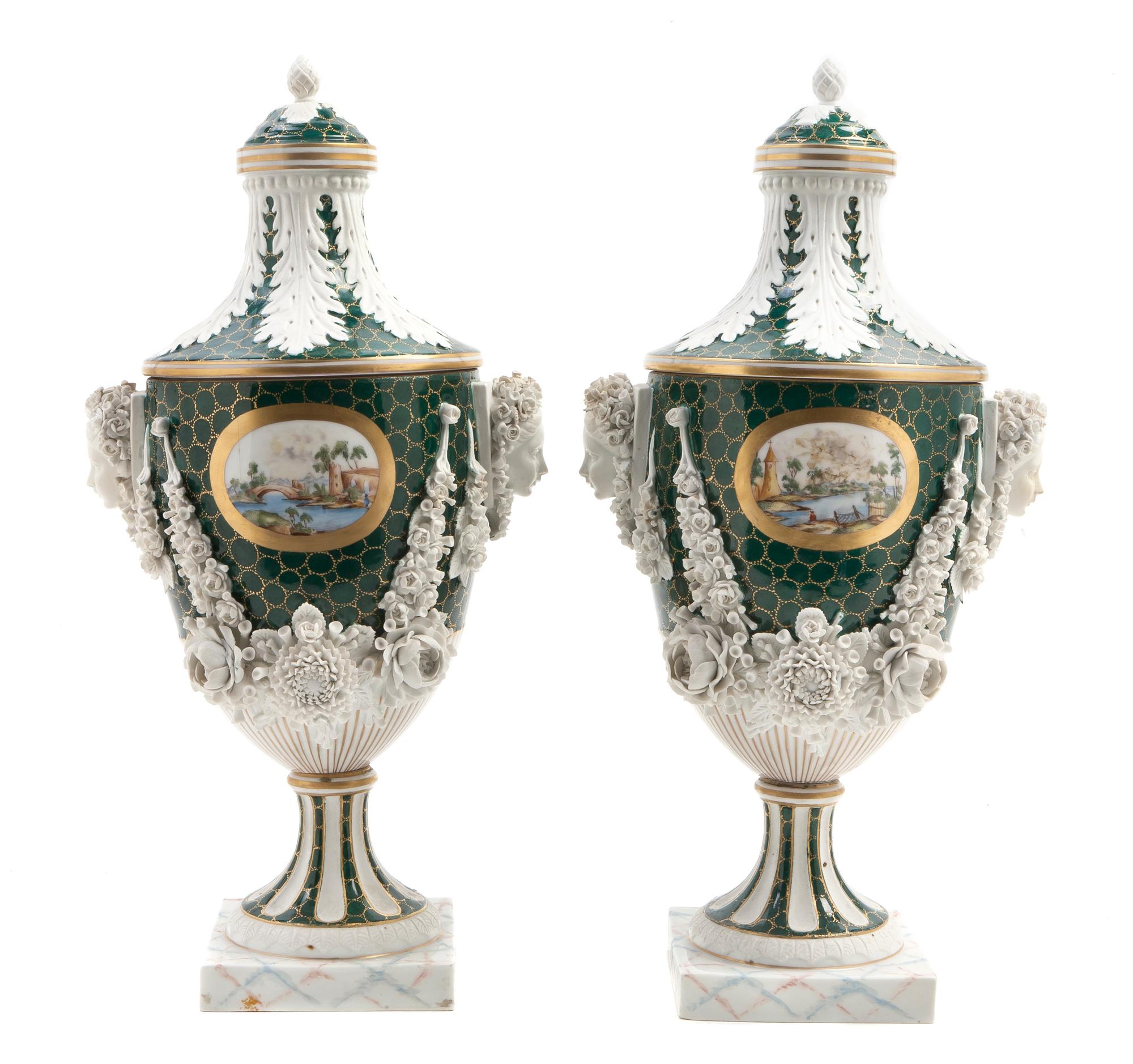 A Pair of English Porcelain Covered Urns, retailed by Ovington Brothers, Height overall 14 1/2 inches.