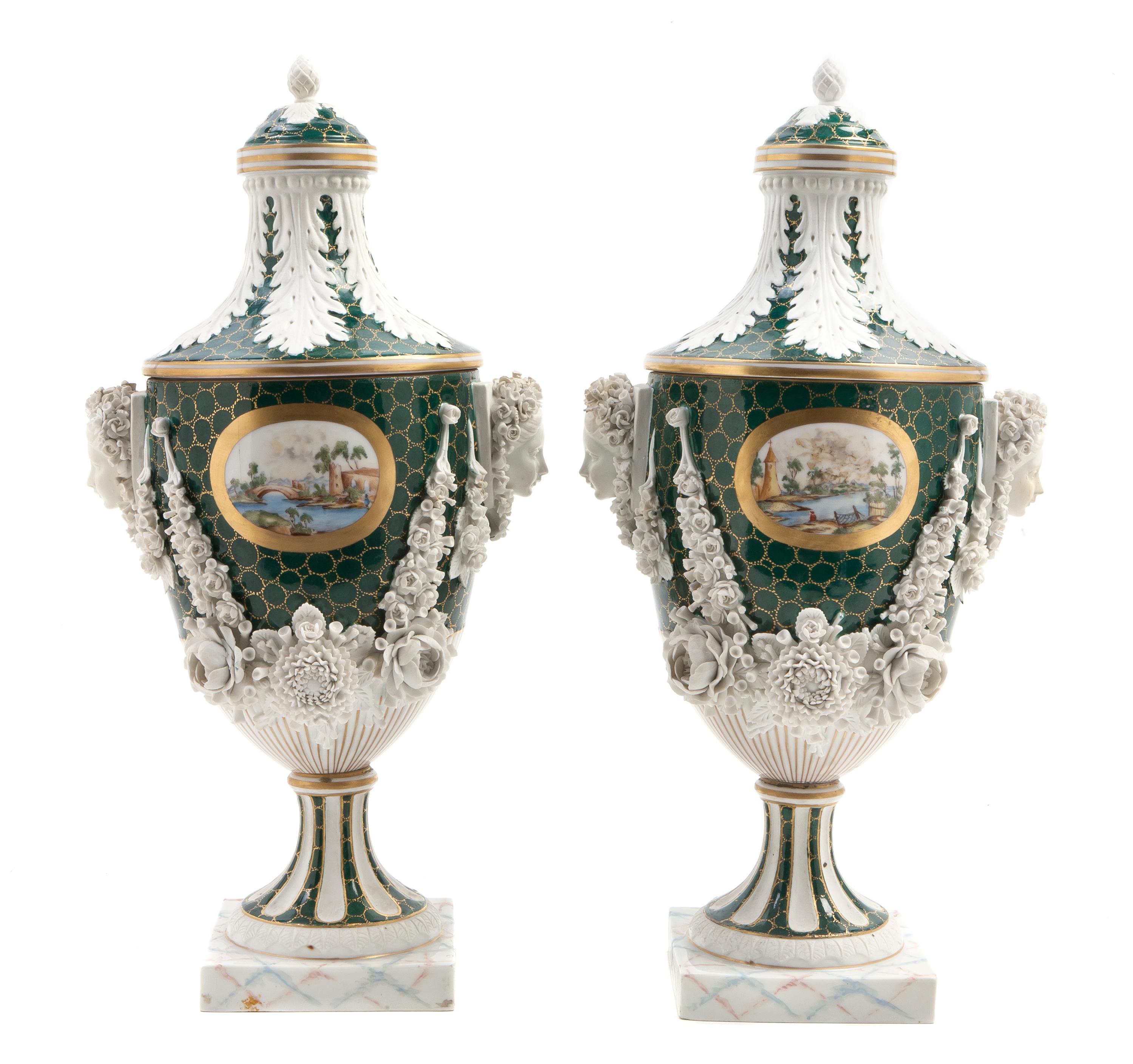 A Pair of English Porcelain Covered Urns, retailed by Ovington Brothers, Height overall 14 1/2 inches.
