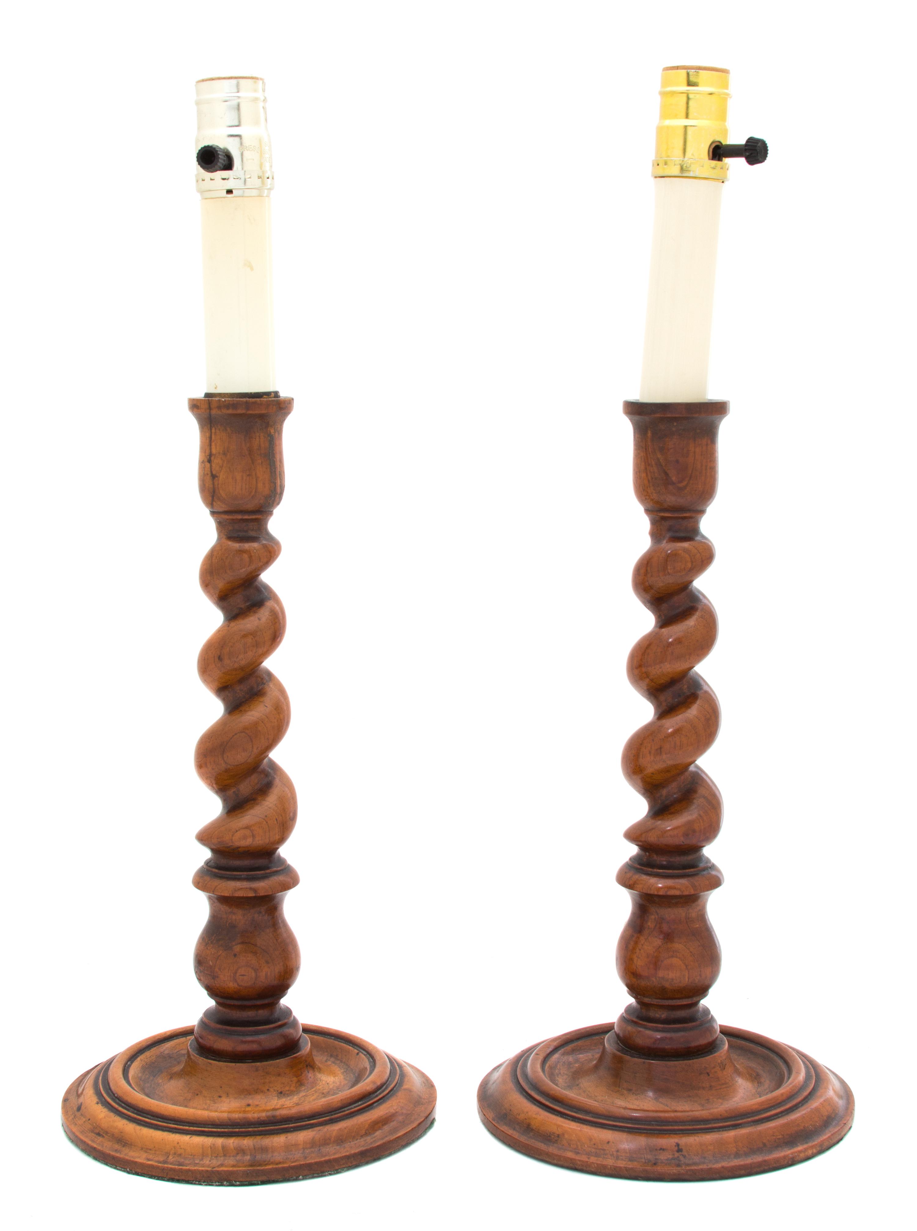 A Pair of English Walnut Barley Twist Candlestick Lamp Bases Height of candlestick 13 1/4 inches. — 20TH CENTURY