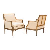 A Pair of Louis XVI Style Gilt Walnut and Upholstered Bergères