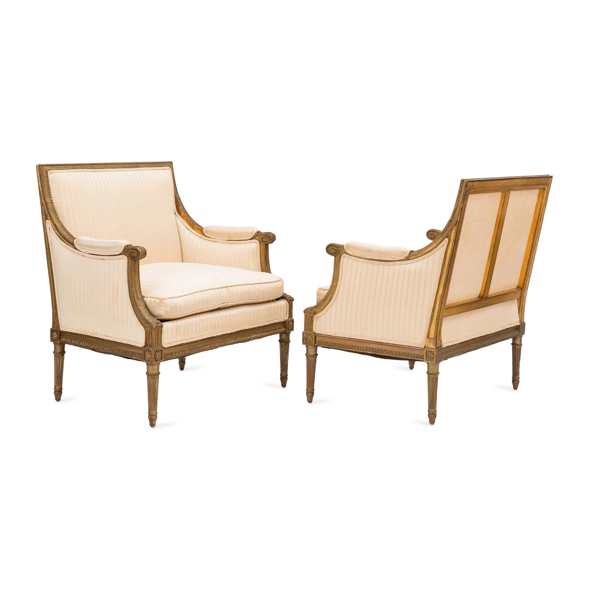 A Pair of Louis XVI Style Gilt Walnut and Upholstered Bergères