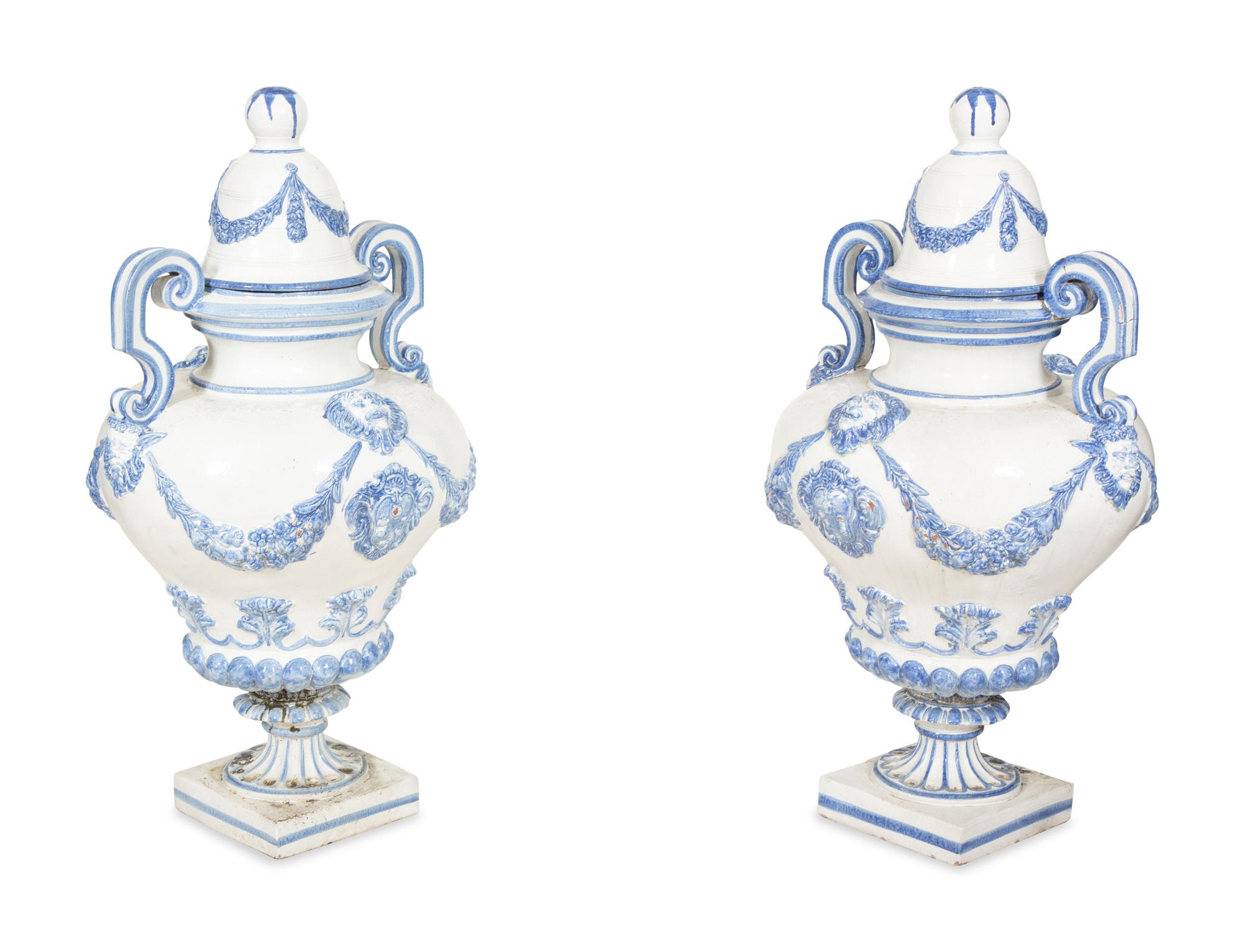 A Pair of Italian Blue and White Glazed Ceramic Covered Urns