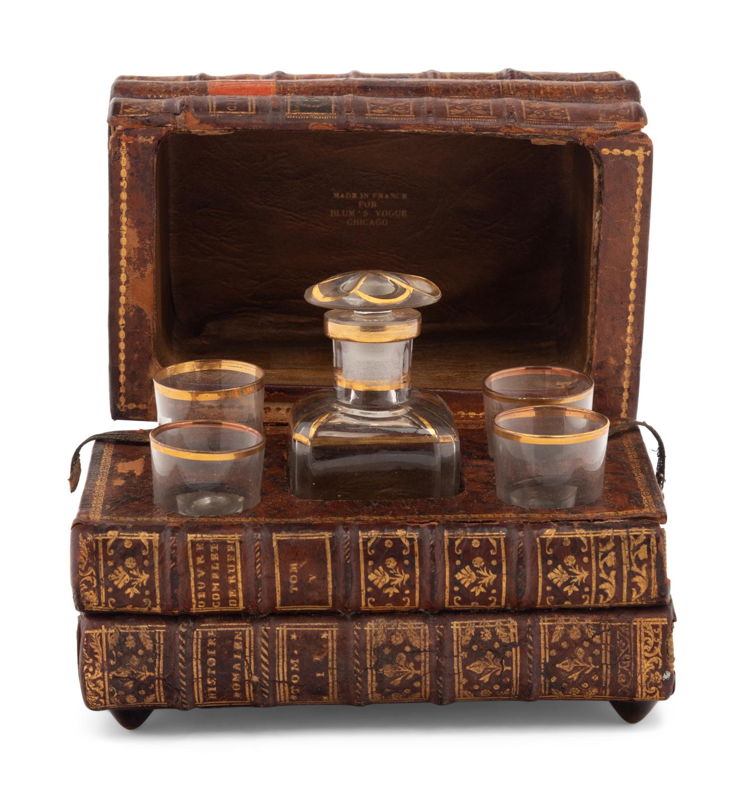 A French Musical Faux Book-Form Decanter Set