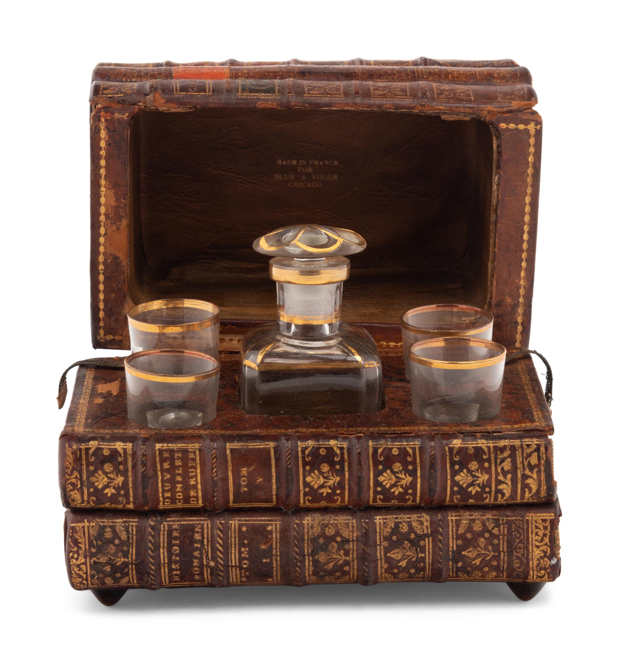 A French Musical Faux Book-Form Decanter Set