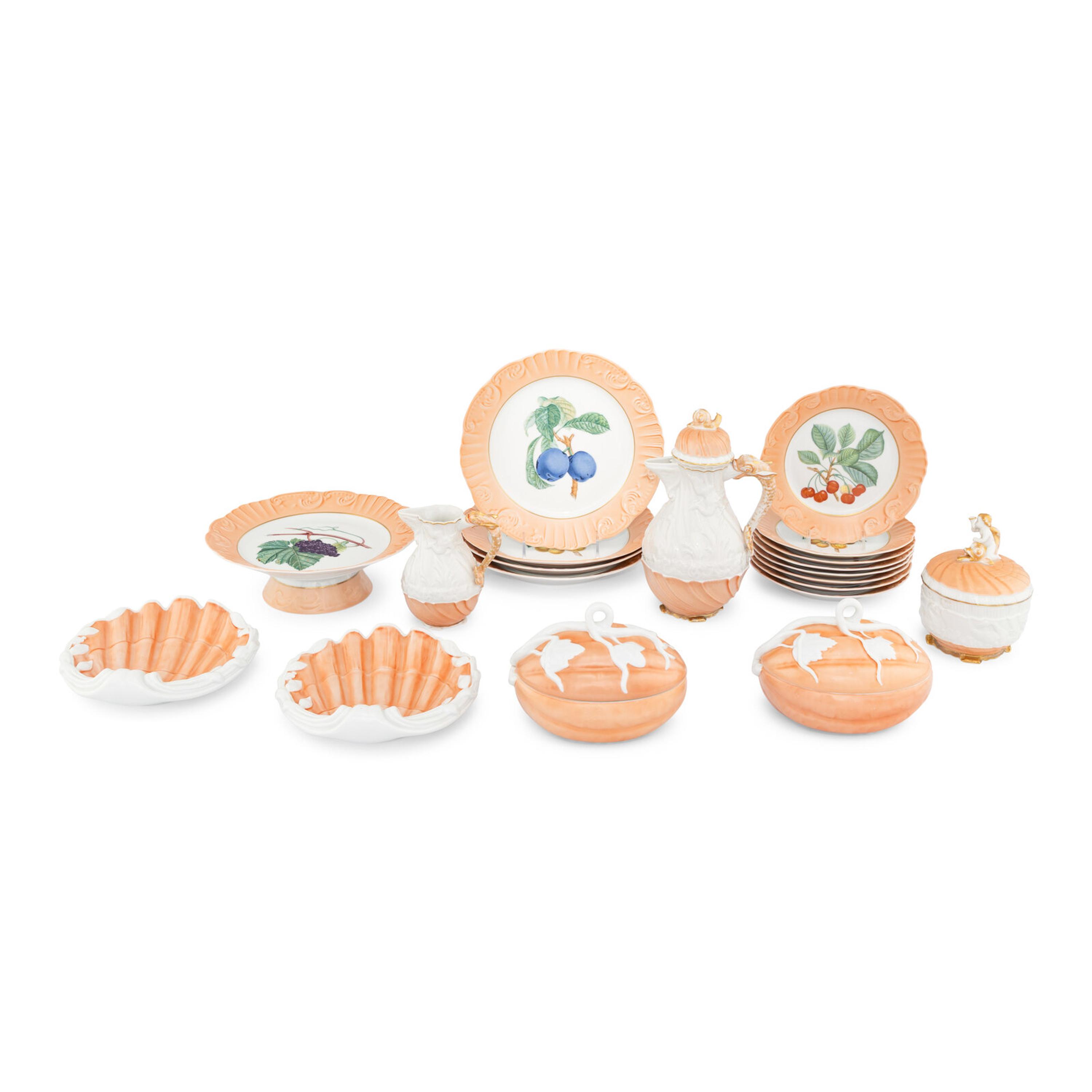 A Collection of Mottahedeh Salmon Porcelain Table Articles