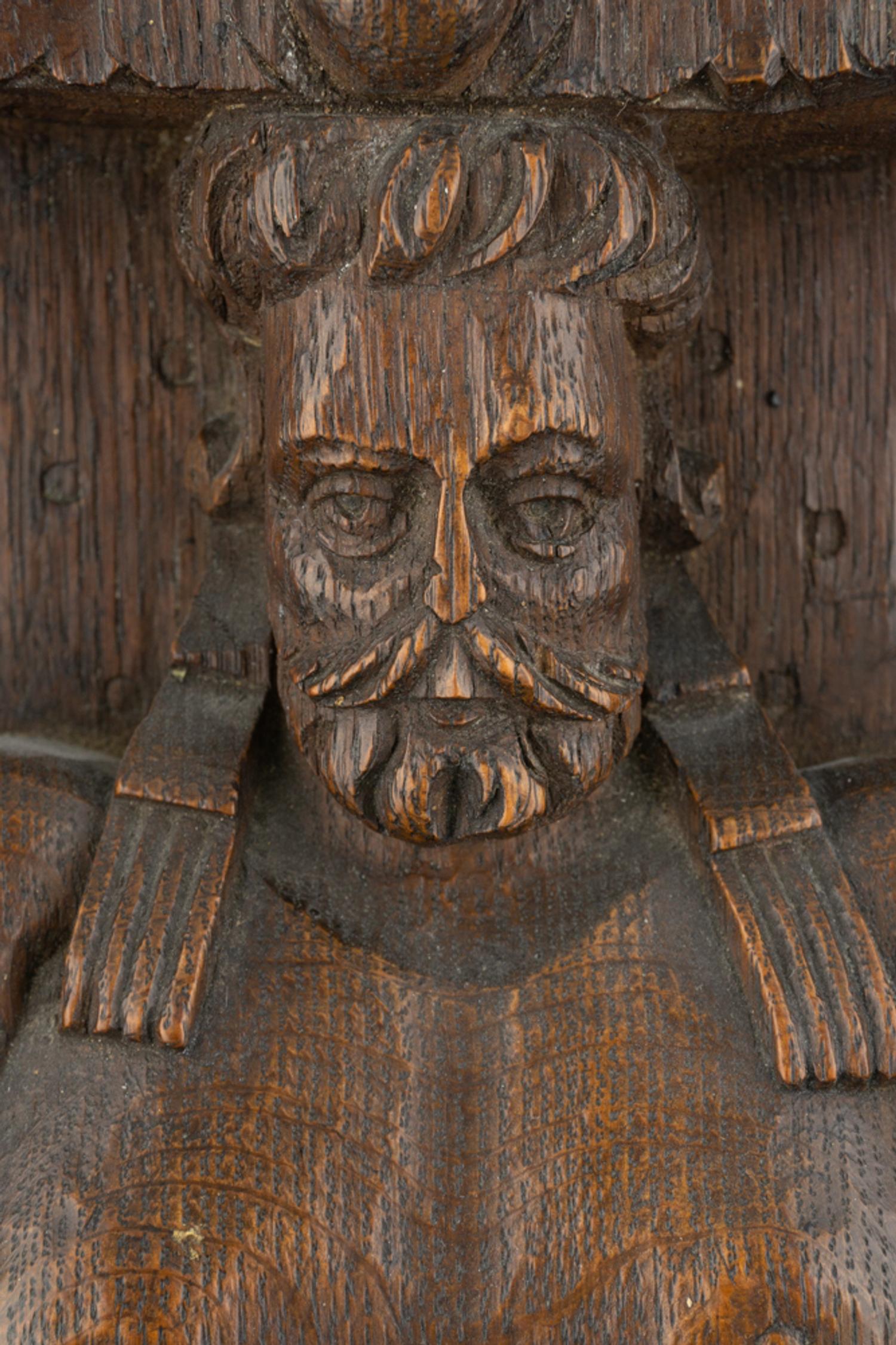 A Group of Three Carved Oak Figural Pilasters
