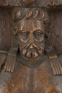 A Group of Three Carved Oak Figural Pilasters