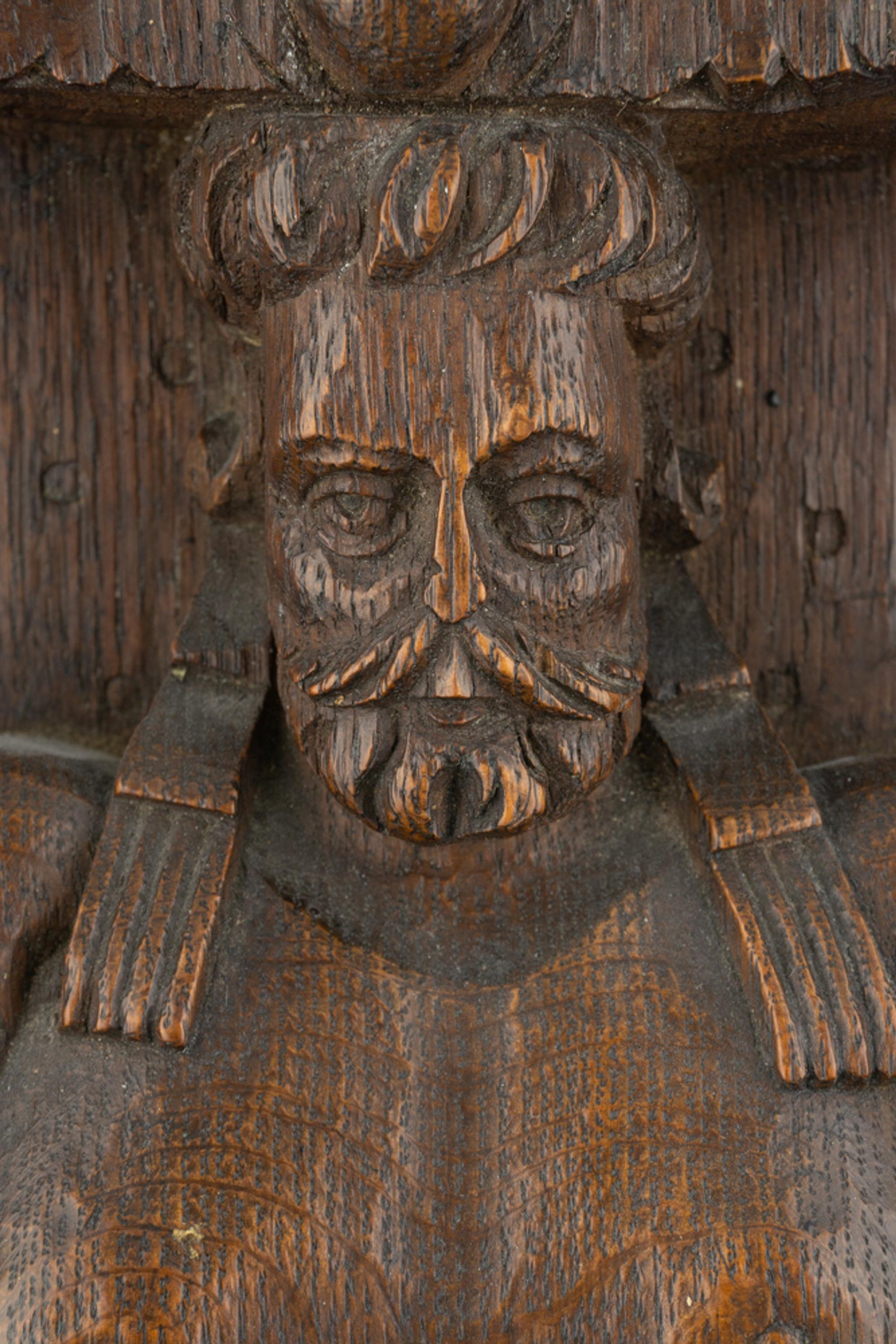A Group of Three Carved Oak Figural Pilasters