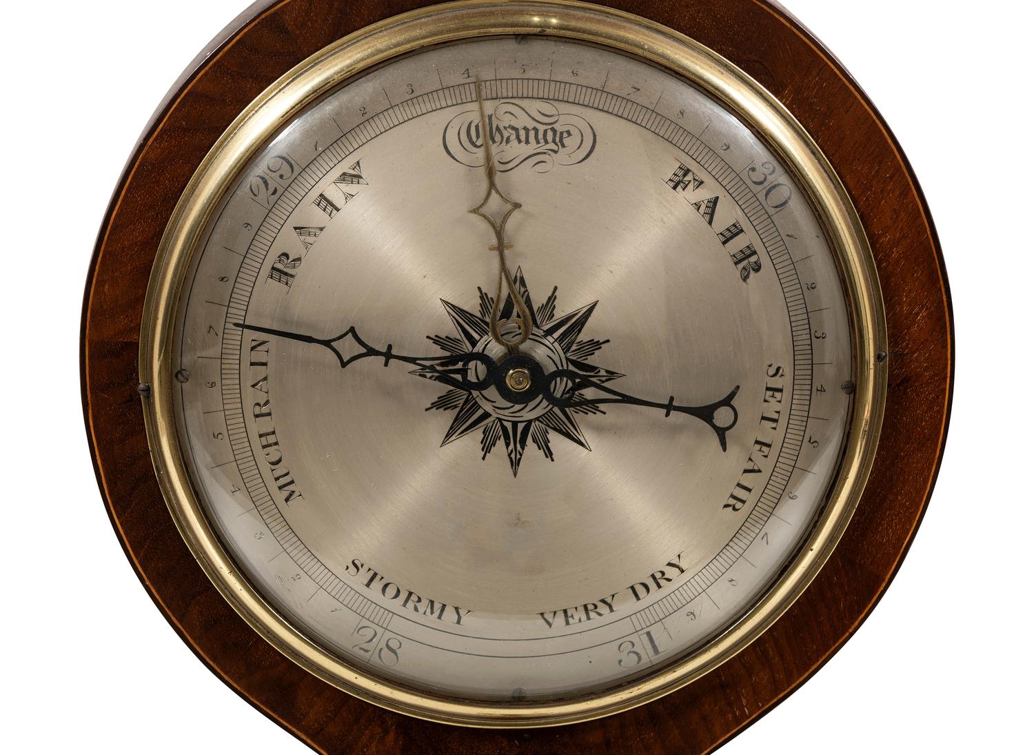 A Regency Mahogany Wheel Barometer