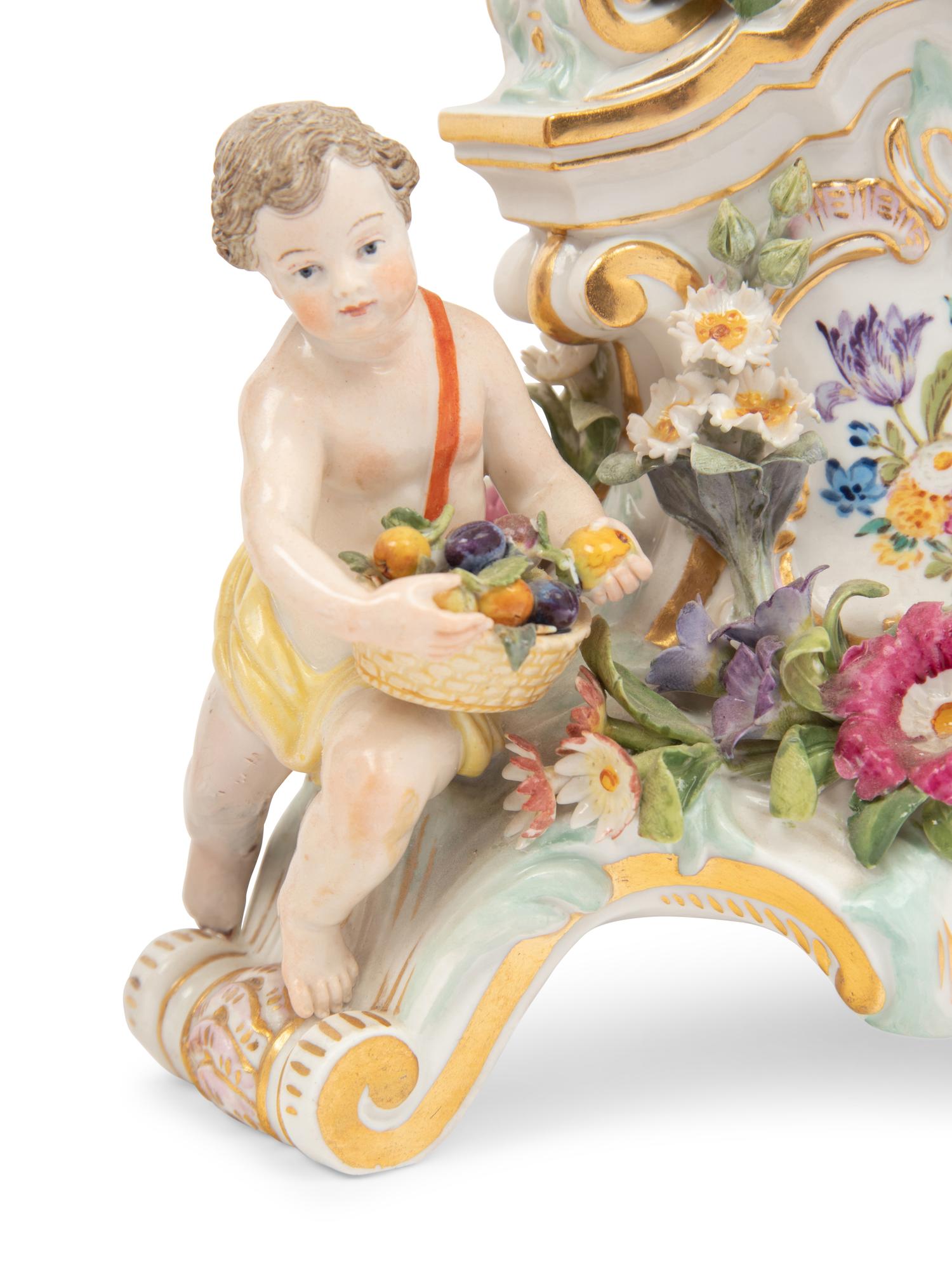 A Meissen Porcelain Clock Garniture and Clock Stand