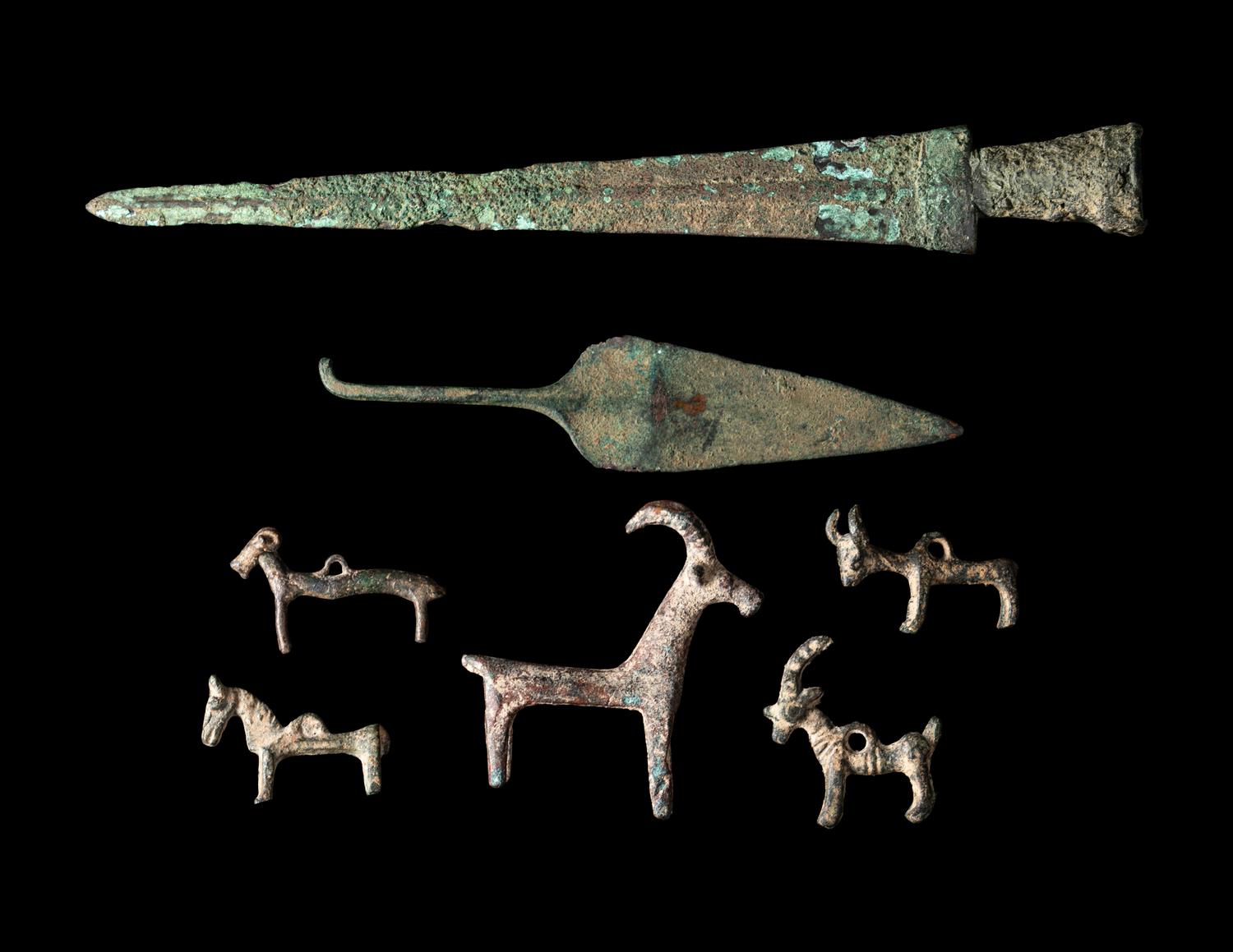 A Group of 7 Luristan Bronze Objects Including Animal Figures and Spearheads