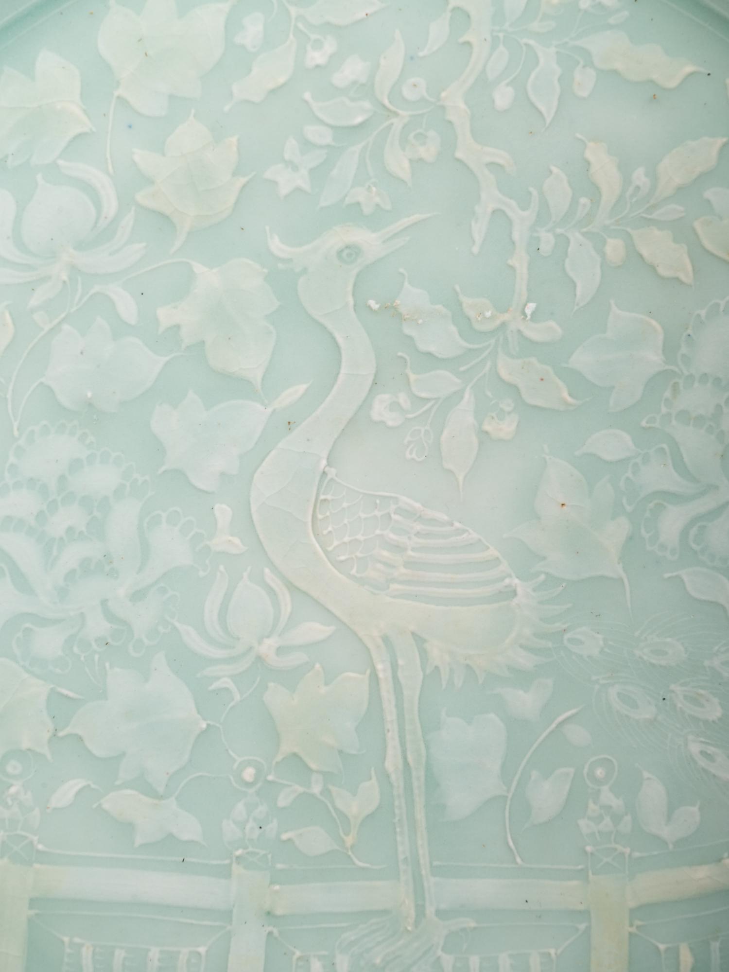 A Chinese Molded Celadon Glazed Porcelain Charger