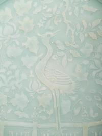 A Chinese Molded Celadon Glazed Porcelain Charger
