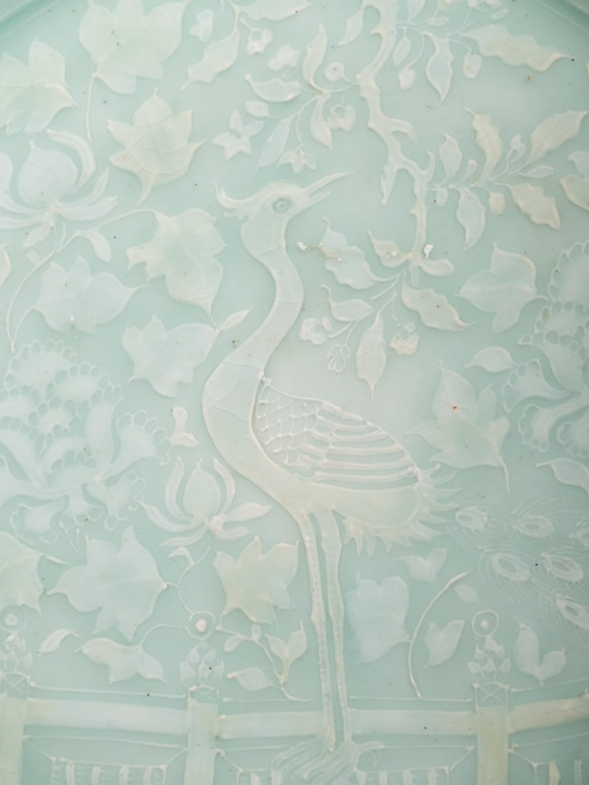 A Chinese Molded Celadon Glazed Porcelain Charger