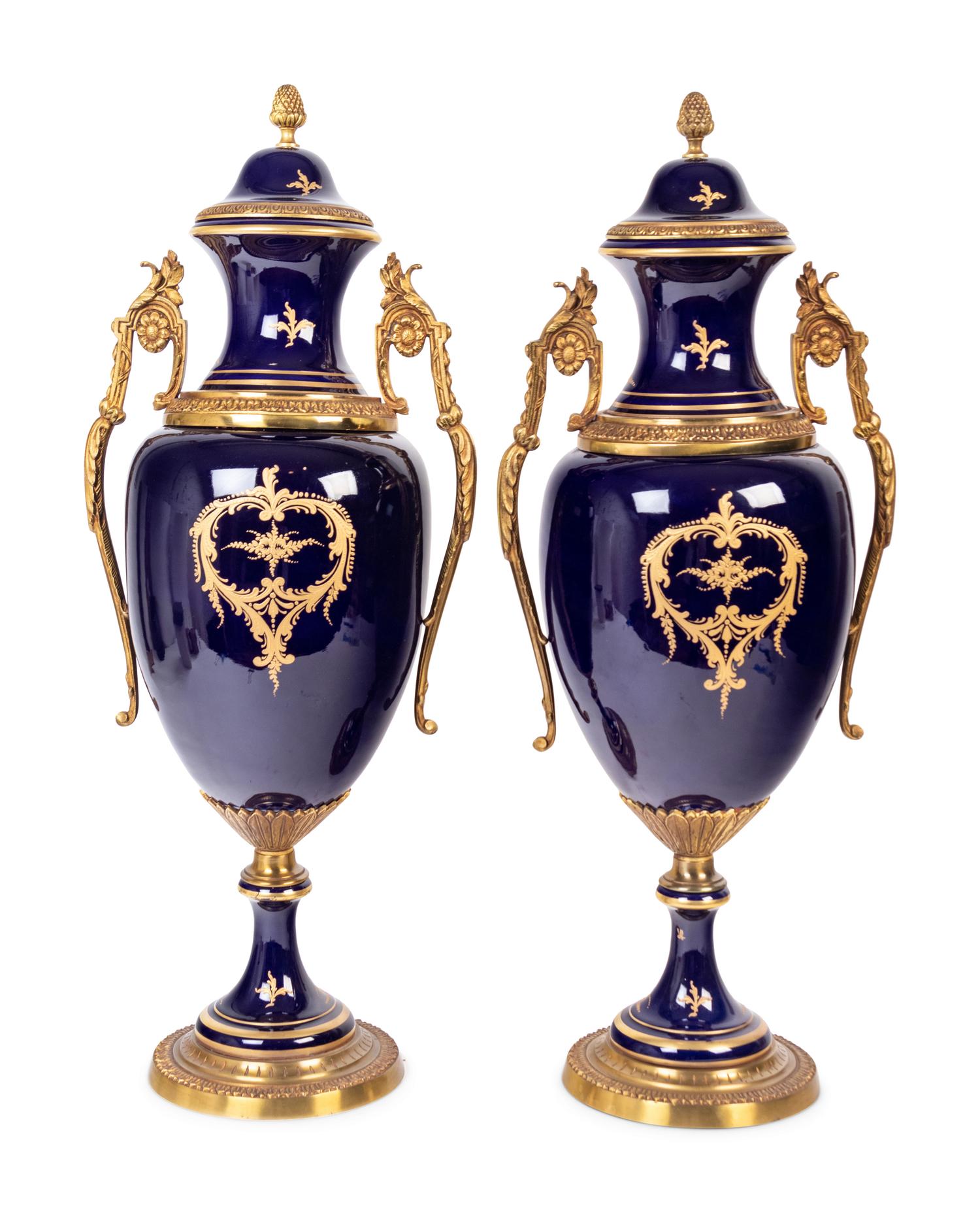 A Pair of Sèvres Style Gilt Metal Mounted Porcelain Urns