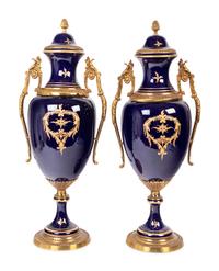 A Pair of Sèvres Style Gilt Metal Mounted Porcelain Urns