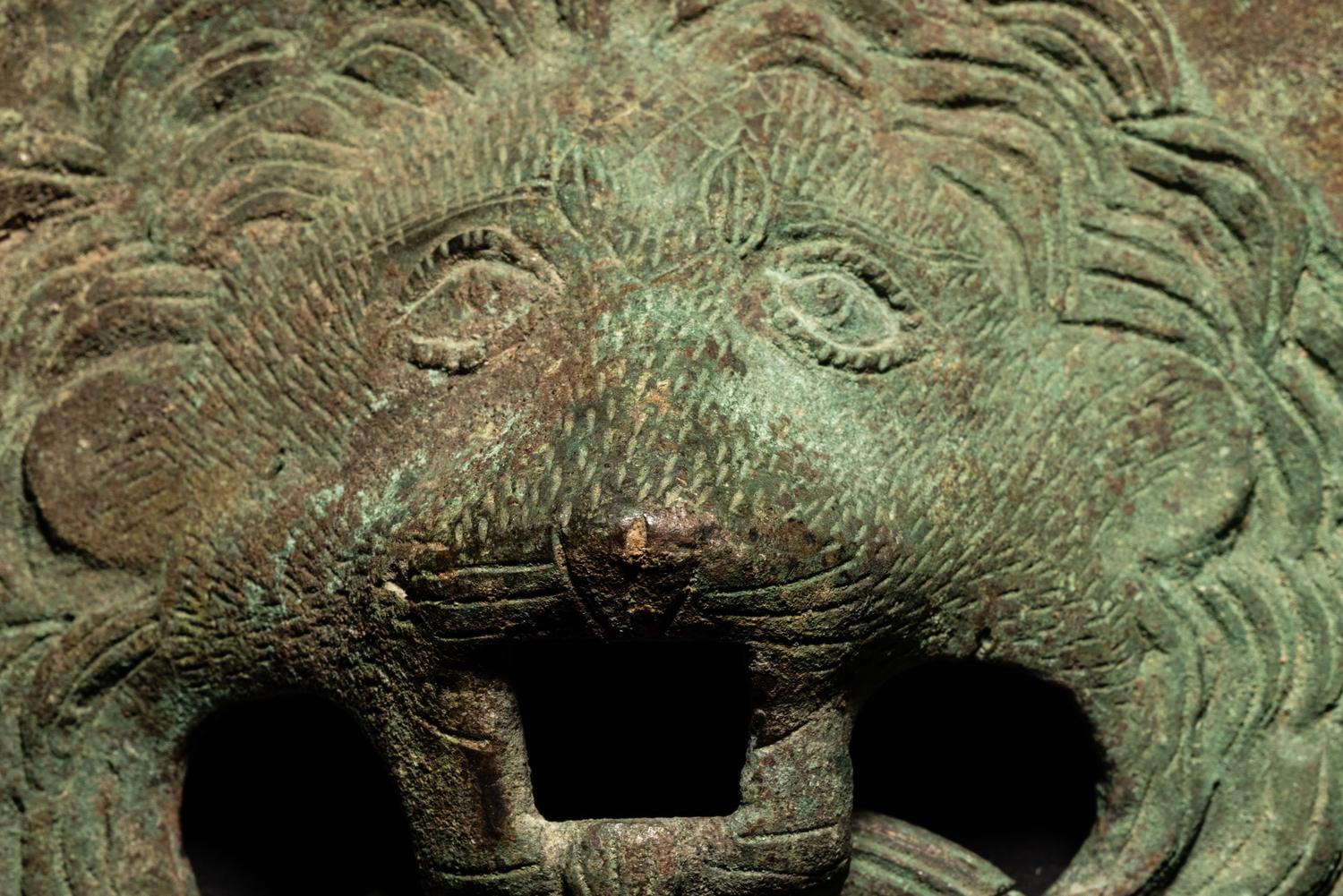 A Pair of Roman Bronze Lion-Headed Handles