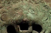 A Pair of Roman Bronze Lion-Headed Handles